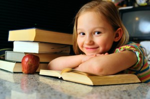 little girl with books